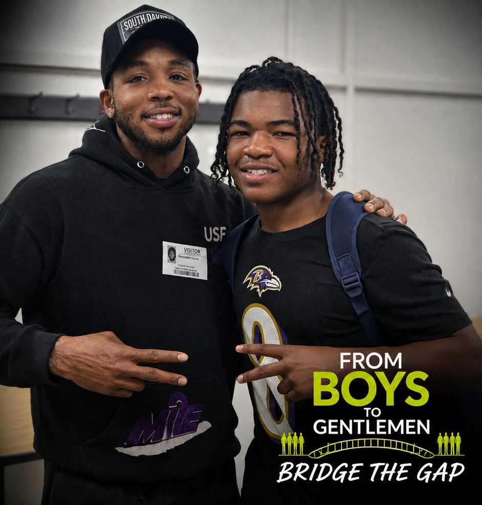 A From Boys to Gentlemen mentor and a student side by side at school.